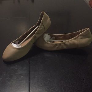 Unopened tan flats